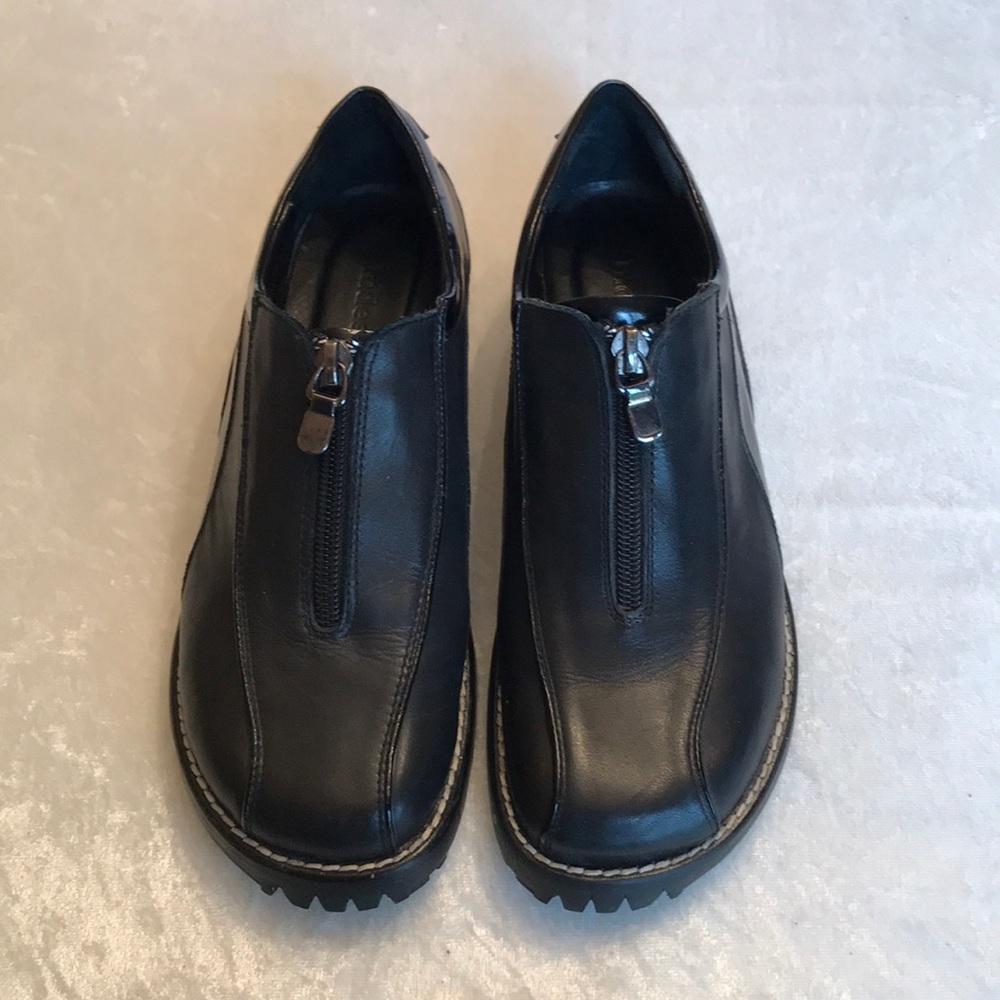 Black zip up shoes by Indeed